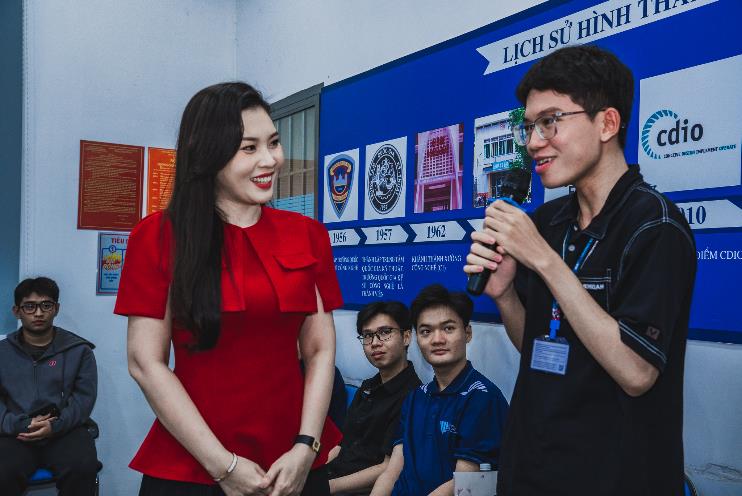 A person and person standing in front of a blue board

AI-generated content may be incorrect.