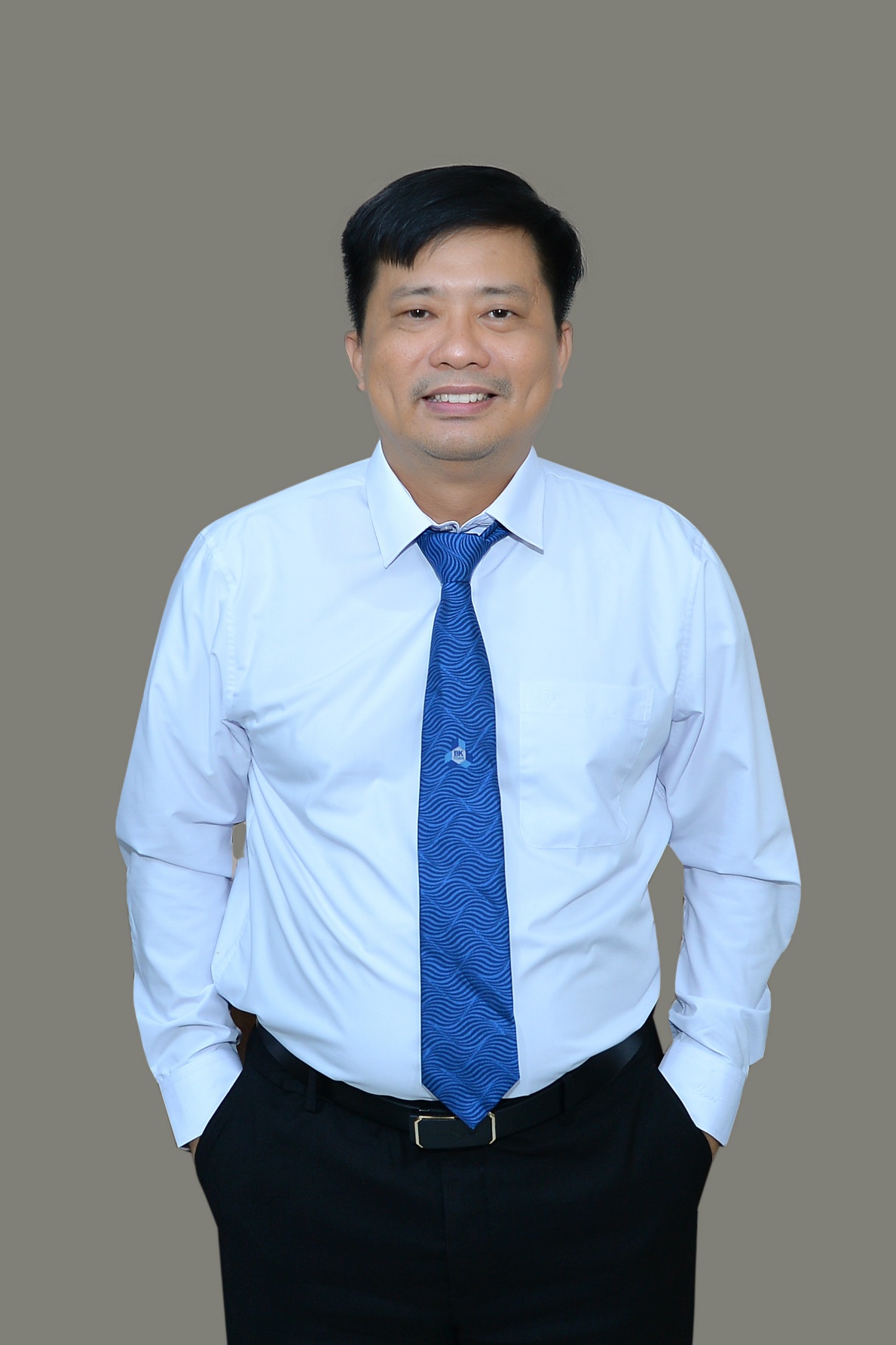 A person in a white shirt and blue tie AI-generated content may be incorrect.