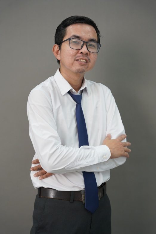 A person in a white shirt and blue tie AI-generated content may be incorrect.